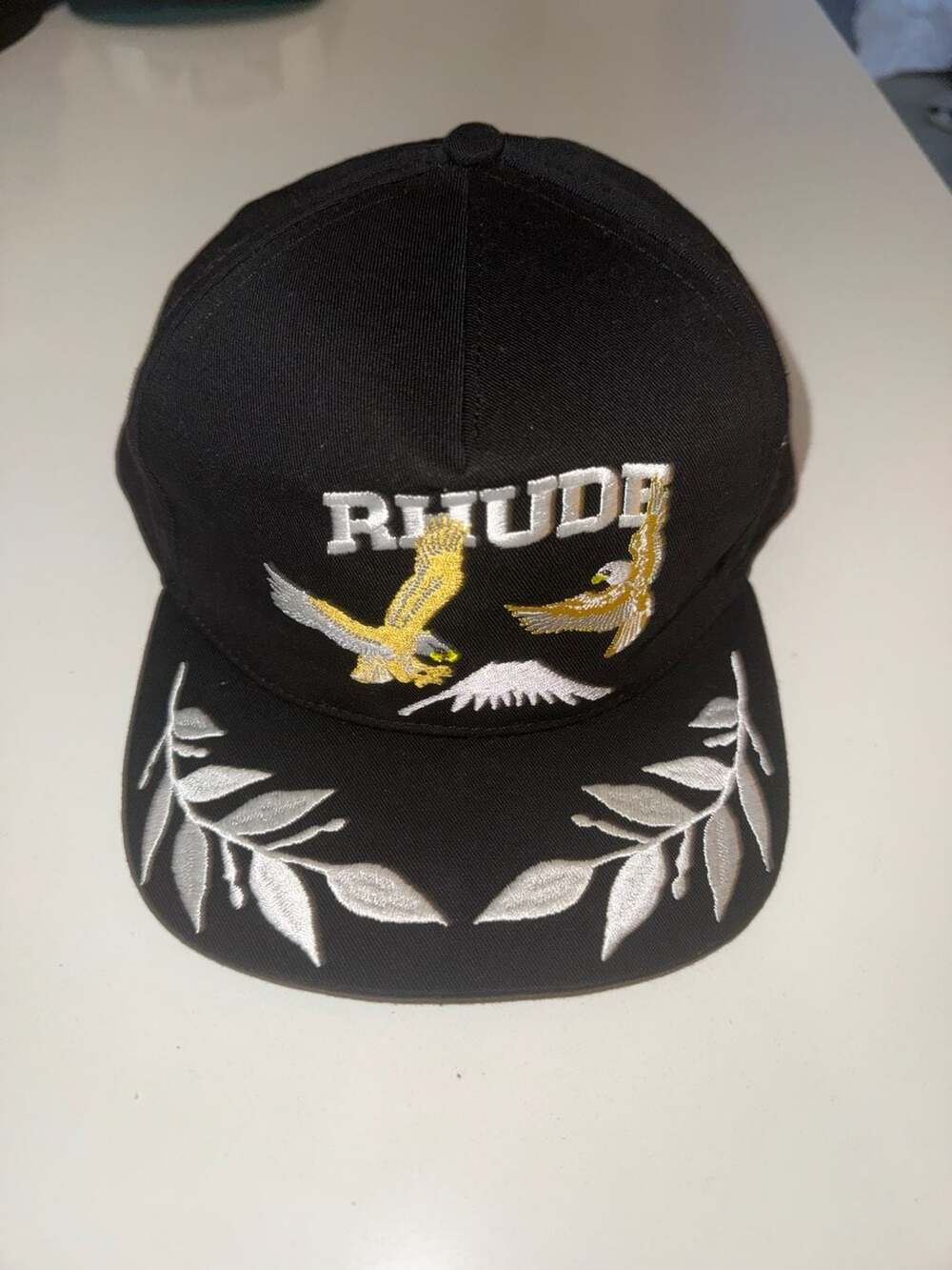 Rhude Black Eagle Souvenir Snapback Hat with Green Underbrim